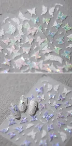 Macro detail of holographic butterfly nail stickers with iridescent laser finish and stars
