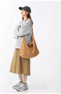 Detailed view of brown corduroy tote bag showing soft texture and large capacity size