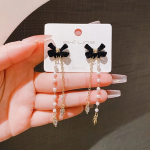 Elegant long fringe earrings with black velvet bows, white pearls, and drop crystals