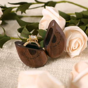 Black walnut heart ring box with gold diamond ring and engraved romantic quote