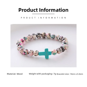 Detailed view of handmade beaded bracelet with turquoise cross and colored wooden beads