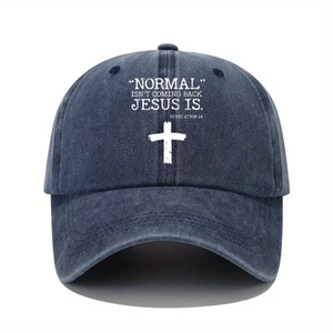 Detail of navy blue washed baseball cap featuring a white cross and religious printed text