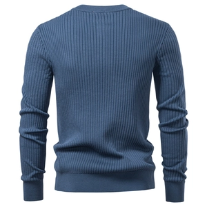 Close-up of blue men's knitted shirt back showing vertical ribbed texture and slim hem