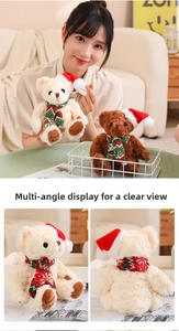 Close-up of plush Christmas teddy bear with red hat, knit scarf and Happy Bear embroidery