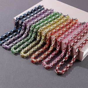 Detailed view of colorful 8mm stainless steel link chains in blue, purple, and gold