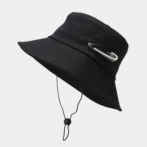 Black wide brim bucket hat with rhinestone safety pin and adjustable windproof strap