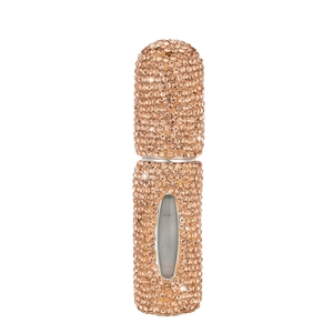 Macro view of rose gold rhinestone-encrusted portable perfume atomizer with visual window