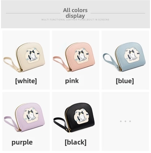Flat lay of cute cartoon cat wallets in five colors with wristlets and zippers