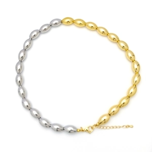 Detail of two-tone gold and silver olive bead necklace with lobster clasp closure