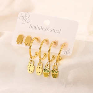 Detail of stainless steel cactus stud earrings with 18K gold plating and green enamel