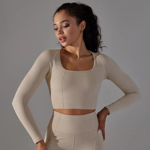 Close-up of seamless beige yoga top with square neckline and honeycomb knit texture
