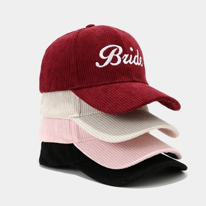 Corduroy baseball caps with Bride embroidery shown in burgundy, white, pink and black