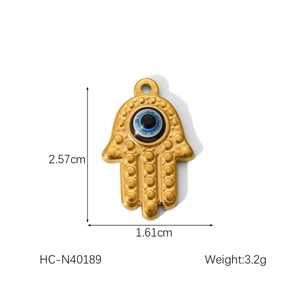 Macro view of Hamsa Hand pendant with blue evil eye bead showing 2.57cm height