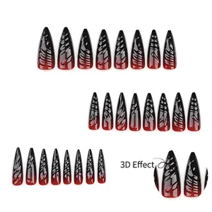 3D textured black and red gradient stiletto press-on nails with embossed swirl details