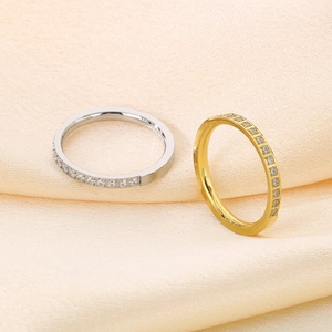 Detailed shot of gold and silver plated stainless steel rings with sparkling crystals
