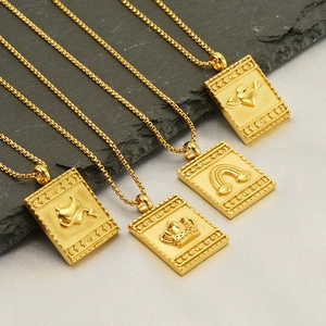Gold plated stainless steel pendant necklaces featuring engraved symbolic rectangle charms