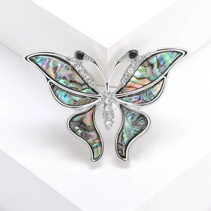 Exquisite butterfly brooch with natural abalone shell wings and sparkling crystals
