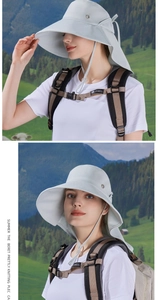 Detail of light grey wide brim sun hat with adjustable cord and ponytail hole for hiking