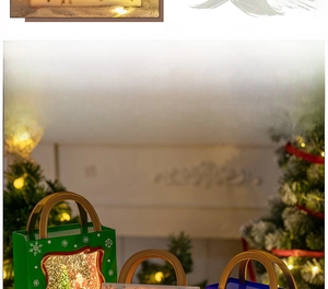 Close-up of a festive Christmas lantern with Santa scene and warm LED glowing light