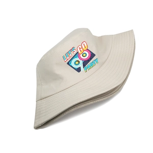 Detailed view of retro 90s cassette tape print on beige cotton bucket hat fabric