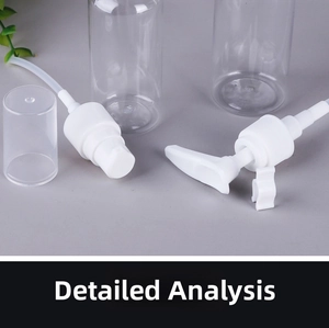 Detail view of clear PET travel bottle components with pump head and spray nozzle
