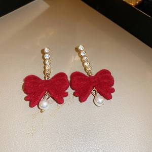 Elegant red flocked bow earrings with white pearls and rhinestones on gold metal studs