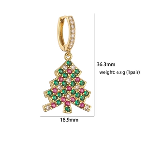 Macro shot of gold Christmas tree earrings with colorful zircons and size measurements