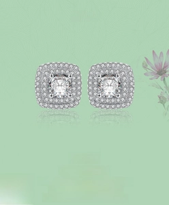 Detailed view of silver square stud earrings with double halo cubic zirconia stones