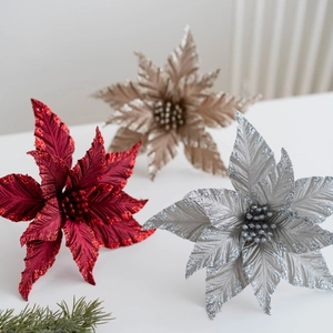 Sparkling 25cm artificial poinsettia flowers in red, gold, and silver for Christmas decor