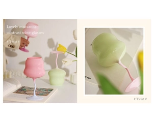 Detail of pink and green macaron glass wine goblets with unique twisted stems