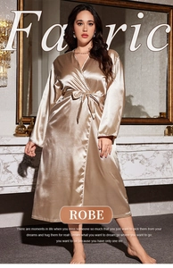 Detailed view of the smooth champagne silk robe fabric with an elegant waist tie design