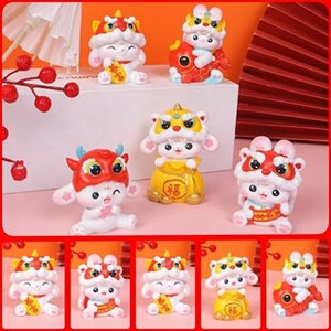 Close-up of cute rabbit figurines in lion dance costumes with lucky koi and money bag details