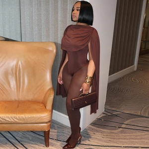 Sleeveless off-shoulder brown jumpsuit with draped shawl overlay and mesh bottom