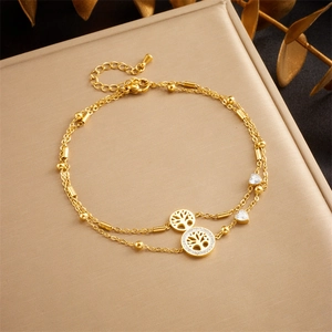 Gold double-layer anklet with tree of life pendants and sparkling zircon stones