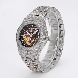 Luxury silver-toned skeleton mechanical watch fully iced out with sparkling crystals