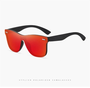 Detail view of stylish polarized sunglasses with red mirror lenses and matte black frame