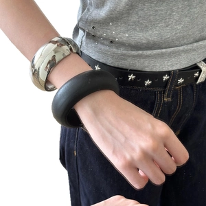 Minimalist thick metal bangles in polished silver and matte black for women