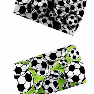 Detail of 15cm wide elastic soccer headbands in classic black, white and green sports patterns