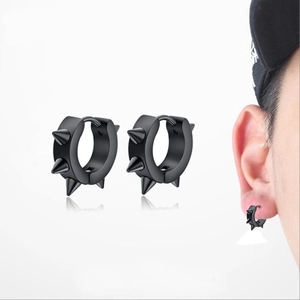 Black punk hoop earrings with three spikes shown in product view and on model ear