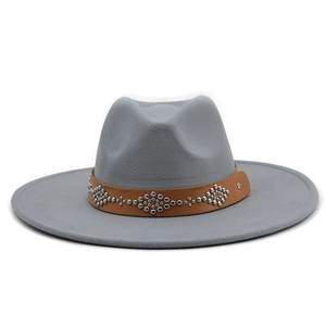 Close-up of grey wool fedora hat with brown leather band and silver rivet detailing
