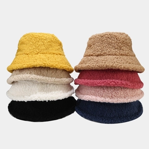 Texture detail of thick faux lamb wool fisherman hats in eight different solid colors