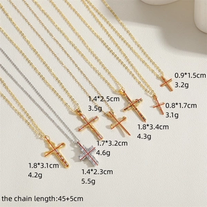 Collection of vintage hollow zircon cross necklaces in gold and silver finishes