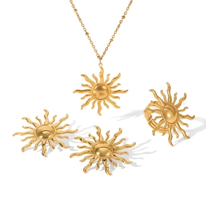 Golden sun jewelry set including stainless steel necklace earrings and ring on white background