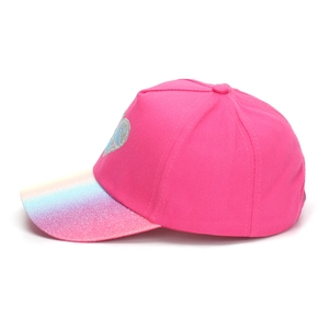 Detail of girls rose pink baseball cap featuring glitter rainbow brim and silver heart