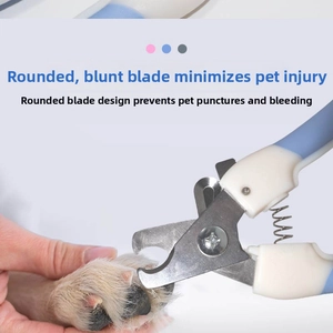 Detail of round safety tip pet nail clipper trimming a dog's claws safely and easily