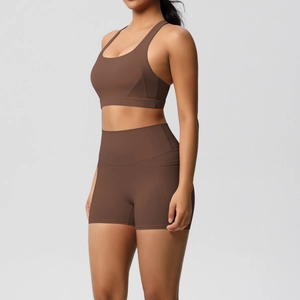 Detail view of high-waist yoga shorts with side pocket in brushed dark brown fabric