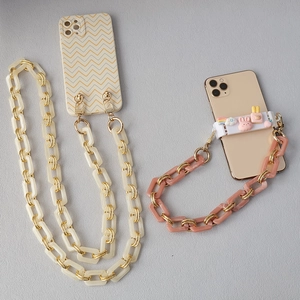 Detail of acrylic and metal thick chain straps with cute charms for phone cases