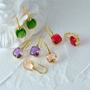 Detailed macro view of S925 sterling silver ear hooks with colorful faceted crystals