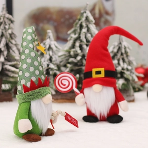 Christmas gnome dolls set with green Noel sign and red lollipop in winter snow scene
