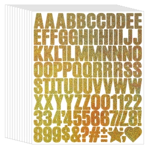 Close-up of 1-inch glitter gold alphabet and number stickers for scrapbooking and DIY crafts
